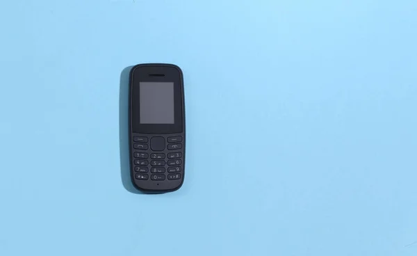 Tryck Knappen Telefon Blå Bakgrund Ovanifrån — Stockfoto