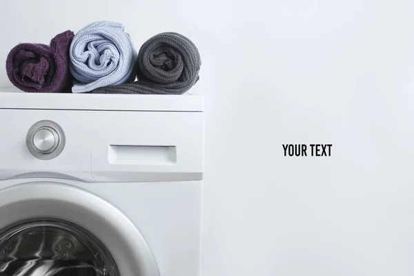 Colored Rolled Sweaters Washing Machine White Background Copy Space — Stock Photo, Image