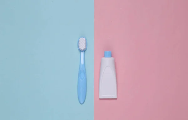 Toy Toothbrush Tube Toothpaste Blue Pink Background Top View Minimalism — Stock Photo, Image
