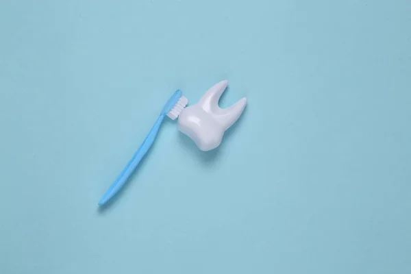 Toothbrush Cleans Toy Plastic Tooth Blue Background Dental Care Concept — Stock Photo, Image