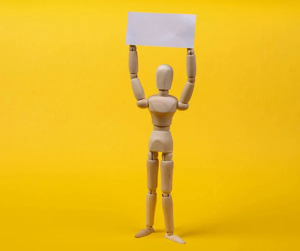 Wooden Mannequin Puppet Standing Blank Sign Protesting Yellow Background — Stock Photo, Image