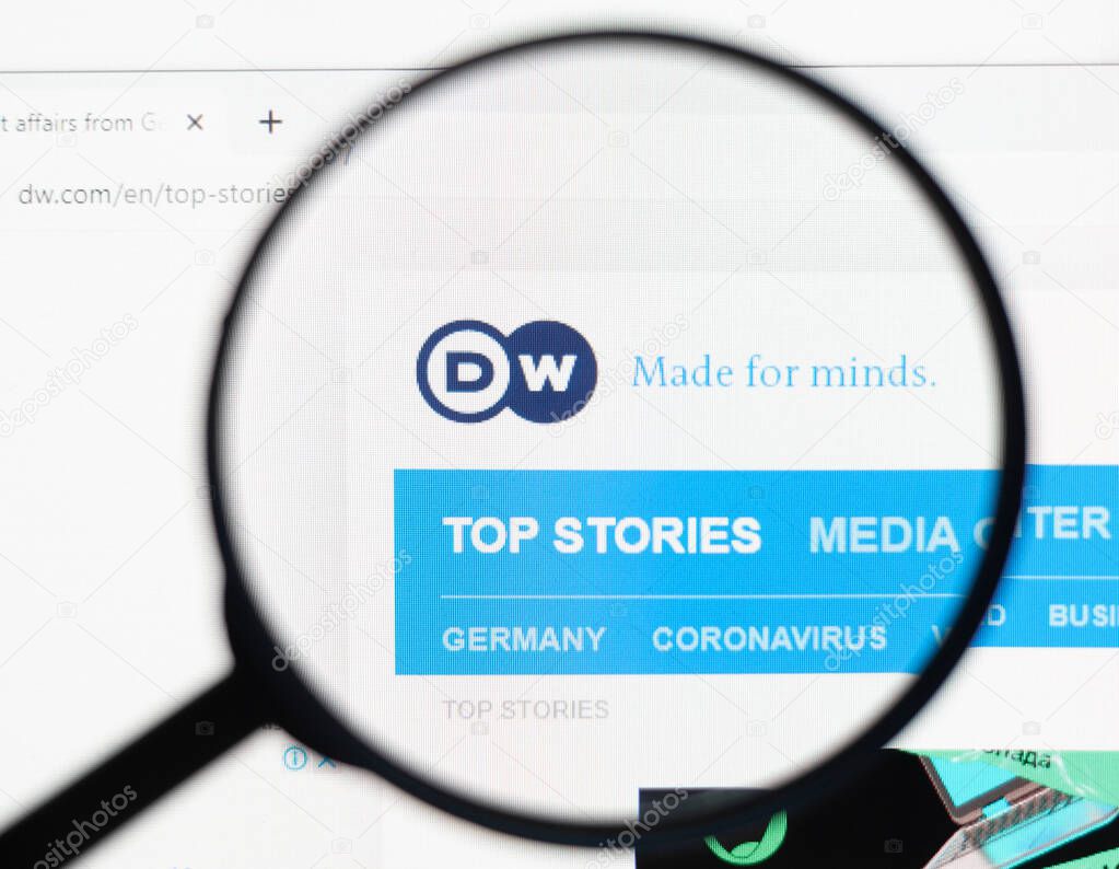 Odessa, Ukraine - December 17, 2020: Deutsche Welle website on monitor screen under magnifying glass.