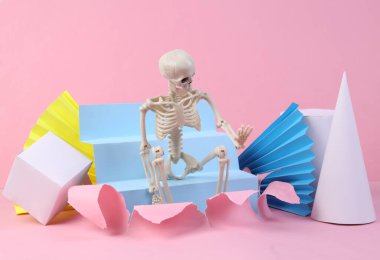 Skeleton on pink background with geometric shapes. Minmalism. Concept art