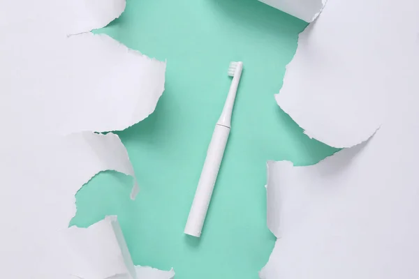 Ultrasonic Toothbrush Blue Background White Torn Paper Teeth Care Concept — Zdjęcie stockowe