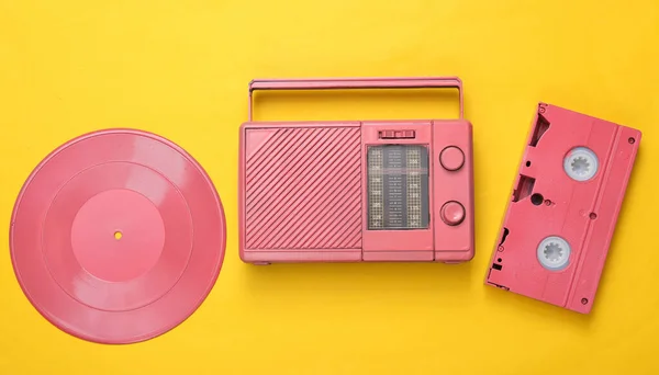Pink Cool Radio Receiver Video Cassette Vinyl Record Yellow Background — Stock Photo, Image