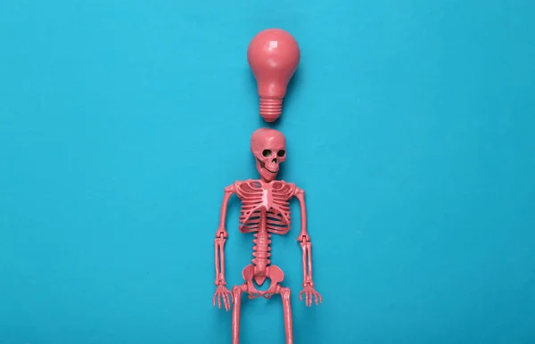 Pink Skeleton Light Bulb Blue Background Top View Fresh Idea — Stock Photo, Image