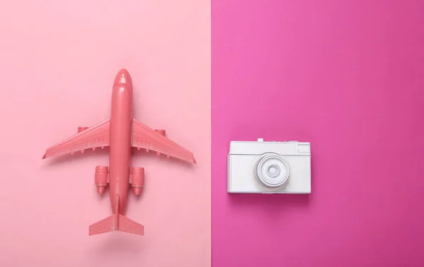 Creative Travel Ayout Toy Air Plane Retro Camera Pink Background — Stock Photo, Image