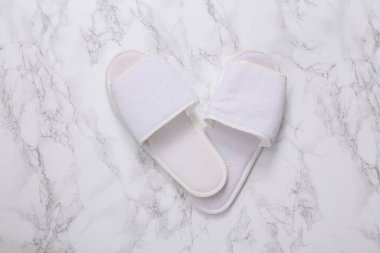 Slippers on marble background. Top view