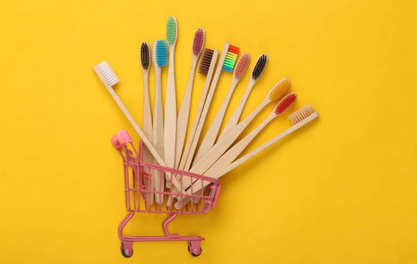 Mini Shopping Trolley Eco Friendly Bamboo Toothbrushes Yellow Background — Stock Photo, Image
