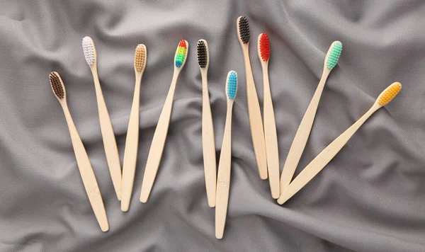 Set Eco Bamboo Toothbrushes Silk Gray Background — Stock Photo, Image