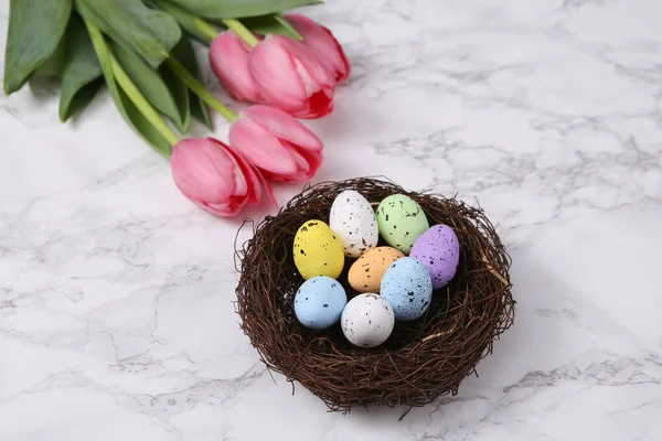 Easter Spring Still Life Nest Colored Eggs Pink Tulips Marble — Stock Fotó