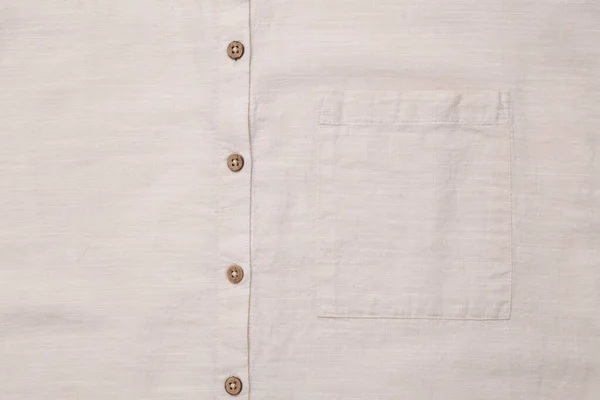 米色棉质衬衫口袋扣子的面料 — 图库照片