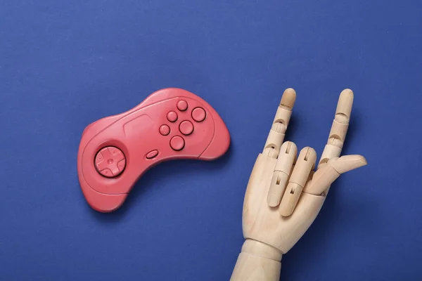 Wooden Hand Shows Rock Gesture Gamepad Blue Background — Stock Photo, Image