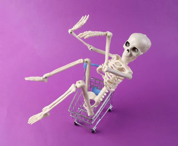 Skeleton Shopping Trolley Purple Background — Stock Photo, Image