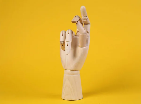 Wooden Hand Snaps Fingers Yellow Background — 스톡 사진