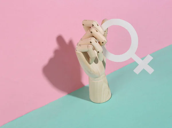 Wooden Hand Holds Venus Symbol Pink Blue Pastel Background — 图库照片