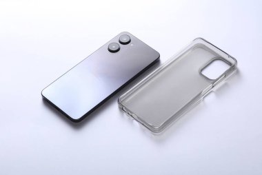 Smartphone with protective silicone case on white background