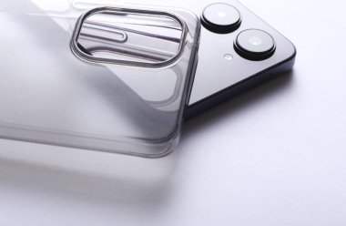 Smartphone with protective silicone case on white background