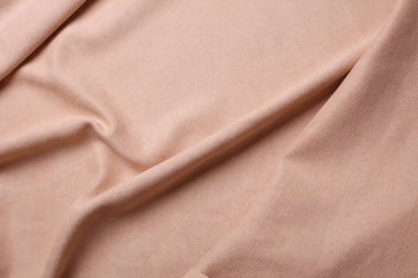 Bej rengi mikro kadife kumaş. Kumaş dalgalı arkaplan