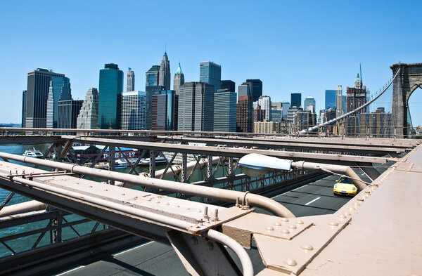 New York, U.S.A. - July 12, 2009: Manhattan,the city center panorama seen fro the Brookllyn Bridge.