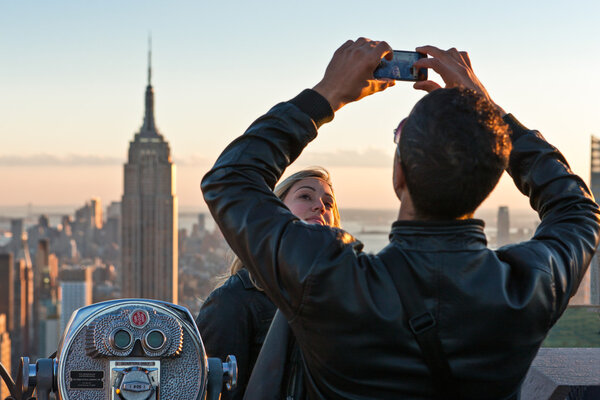 New York, U.S.A. - October 7, 2010: Manhattan, tourists taking pictures from Top of the Rock