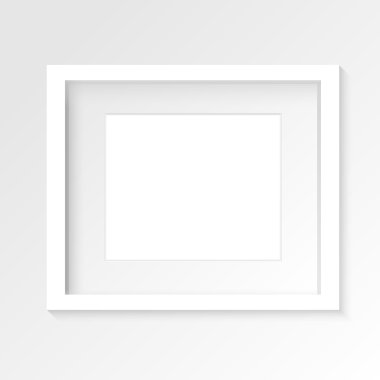 White horizontal photo frame on gray wall with realistic shadows.