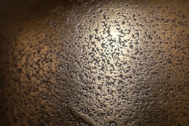 Bir nesnenin özgün bir resminin altın arkaplanı, arkaplan ve konsept için onun dokusunu yakınlaştır