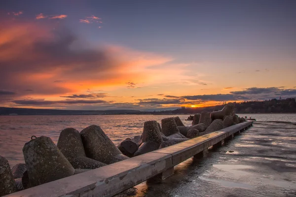 Tramonto su un molo di mare — Foto Stock