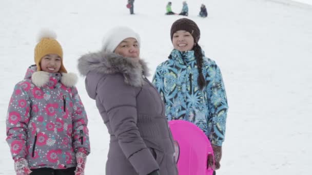 Happy girl with her mother smiling at the camera — Stock Video