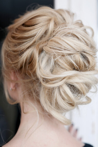 Beautiful bride with fashion wedding hairstyle - on  natural background