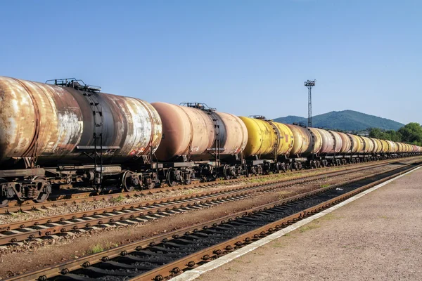 Freight trains.Railroad train of tanker cars transporting crude oil on the tracks. Stock Picture