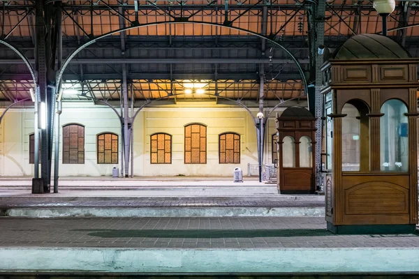 Passenger platform at night on the railway station.