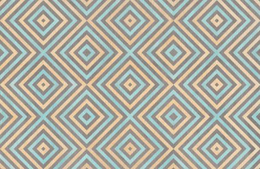 Bej, mavi ve gri renklerde geometrik desen.