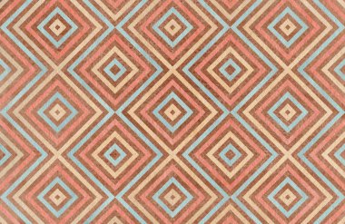 Kahverengi, bej pembe ve mavi renklerde geometrik desen.