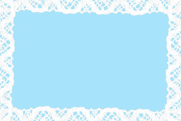 White lace on blue background. — Stock Photo, Image