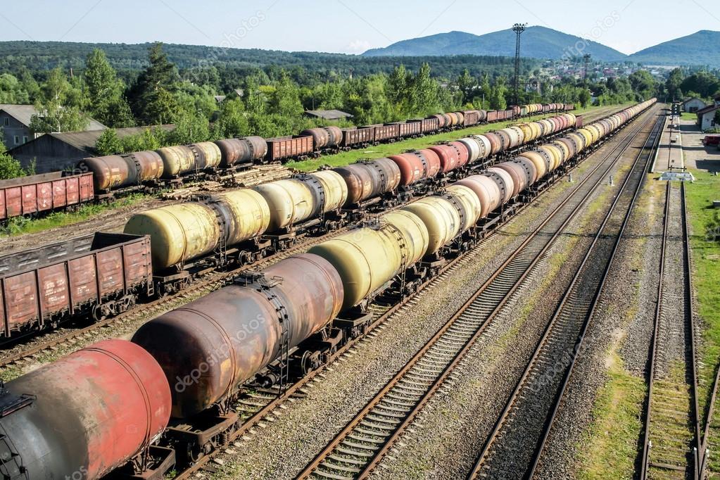 Freight trains.Railroad train of tanker cars transporting crude oil on