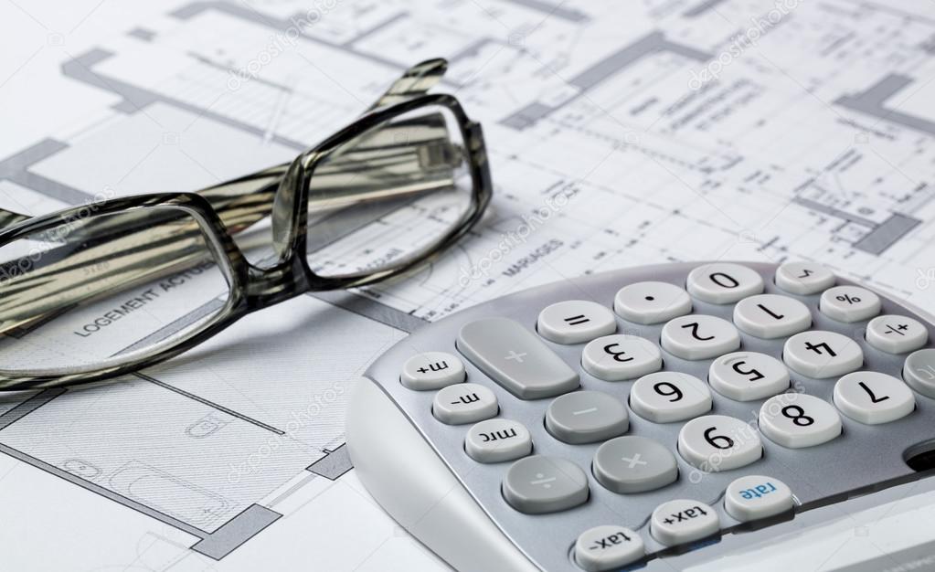 property design and cost concept with architect eyeglasses and calculator on computer rendering