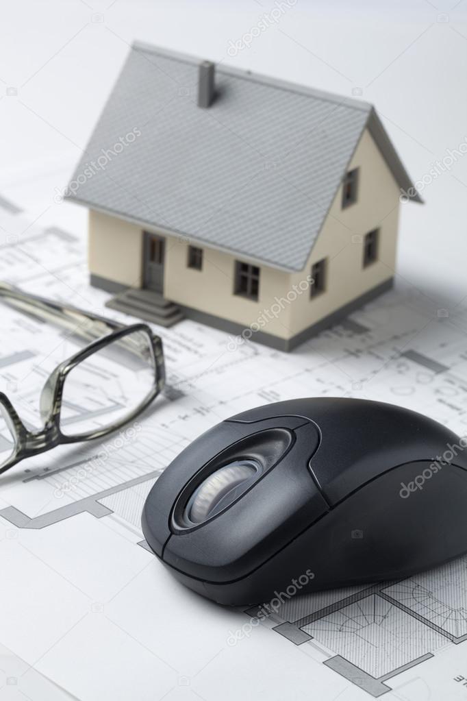 miniature house with eyeglasses on computer rendering