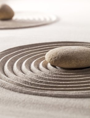 stones in sand for concept of tranquillity or wellness clipart