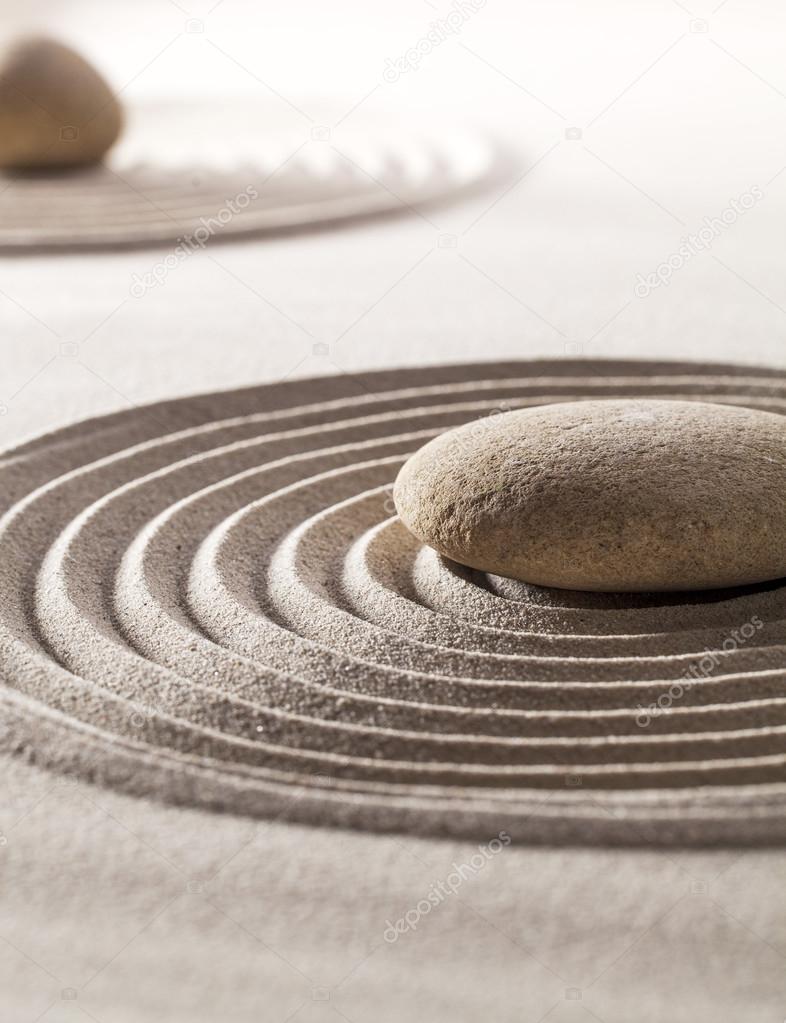 stones in sand for concept of tranquillity or wellness