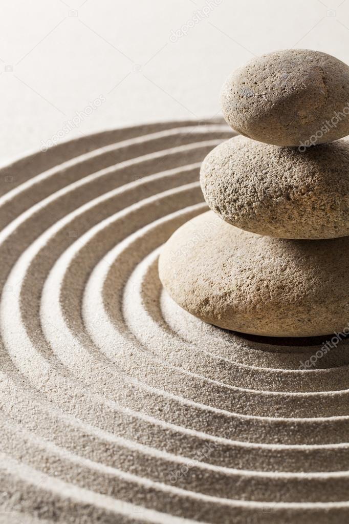 stones or pebbles in sand for concept of purity or wellbeing