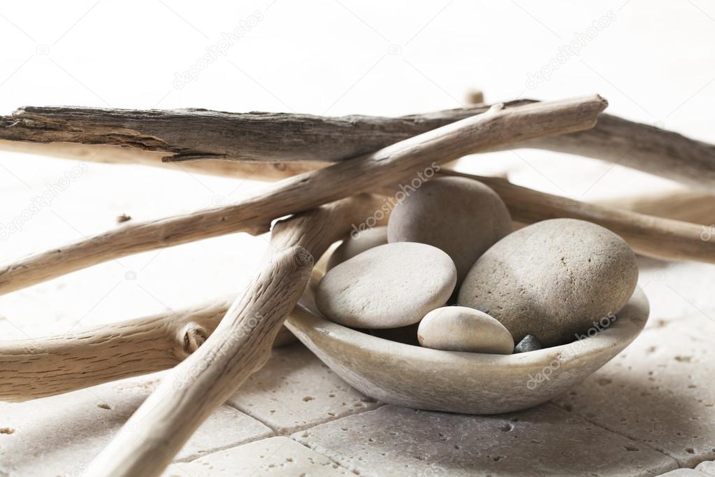 pebbles with drift wood for mineral spa treatment