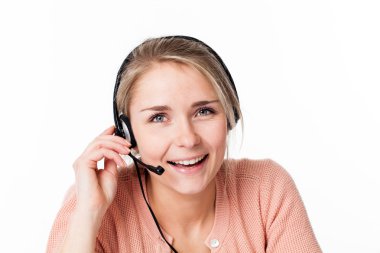 konuksever telefon Yardım Masası çalışma kulaklık ile mutlu bir iş kadını