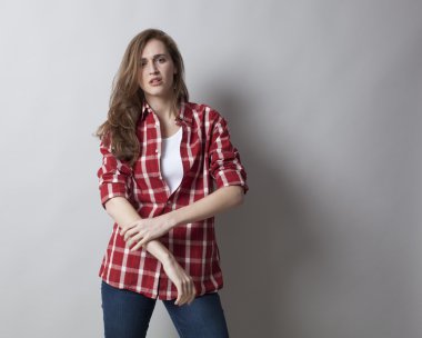 self-assured young woman with rolled up sleeves