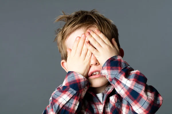 Cute little boy playing hide-and-seek to disappear — Stock Photo, Image