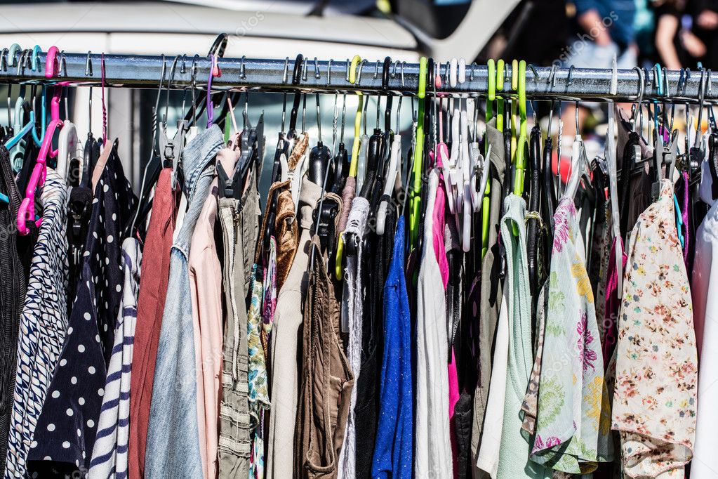 Cheap second hand fashion women's clothes at garage sale Stock Photo by  ©studiograndouest 113928002