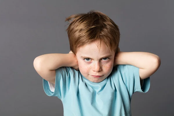 Stubborn young kid teasing, covering closed ears, ignoring parents — Stock Photo, Image