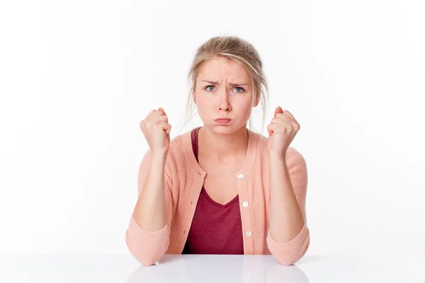 Irritated young blond woman puffing out her cheeks for exasperation — Stock Photo, Image