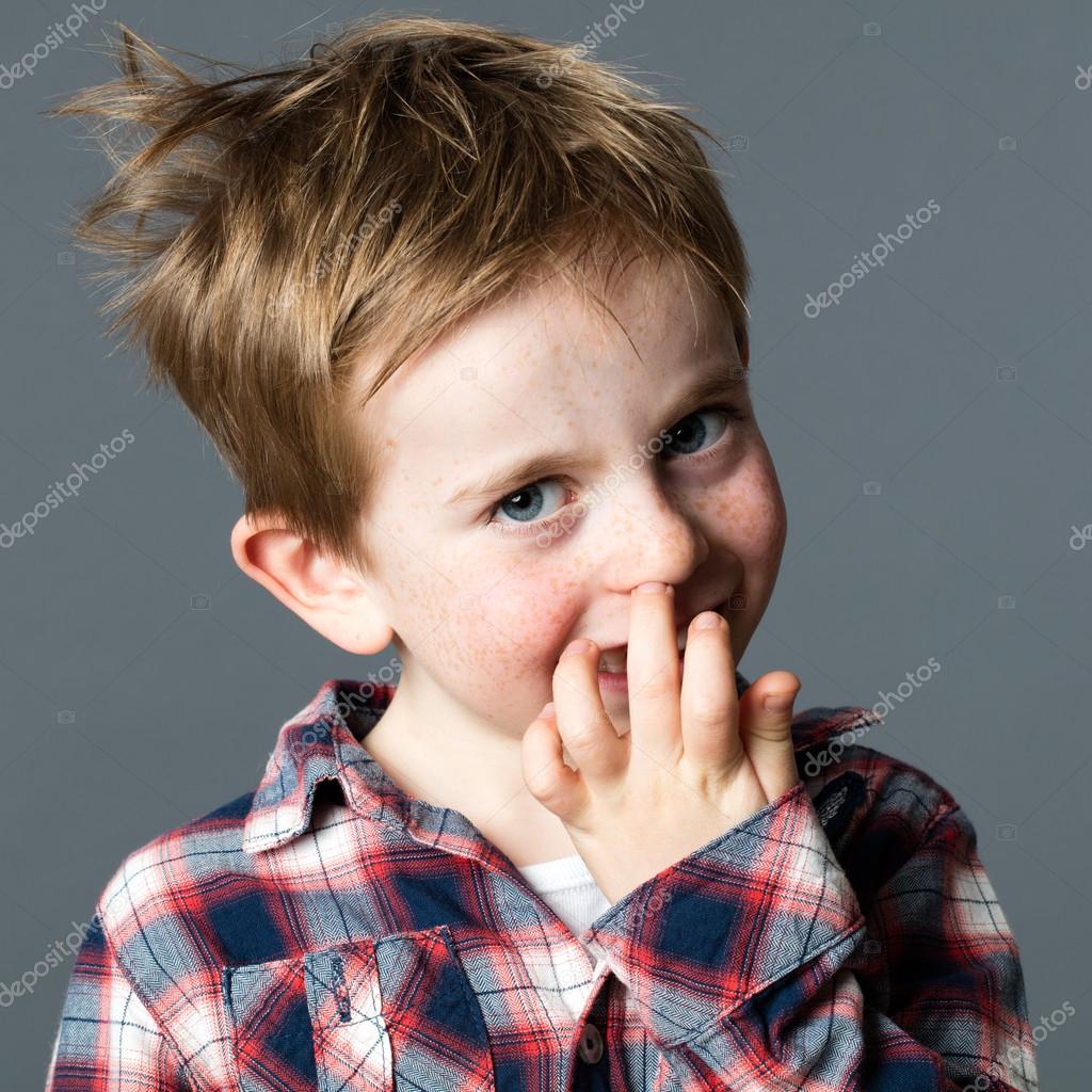Cheeky Little Red Hair Kid Picking His Nose To Provoke Stock