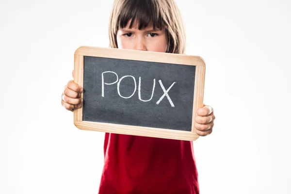 Determined young boy with shield against head lice, French poux — Stock Photo, Image